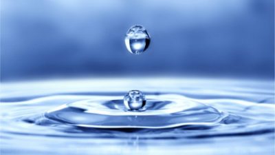 Image of Water Drop into Puddle of Water